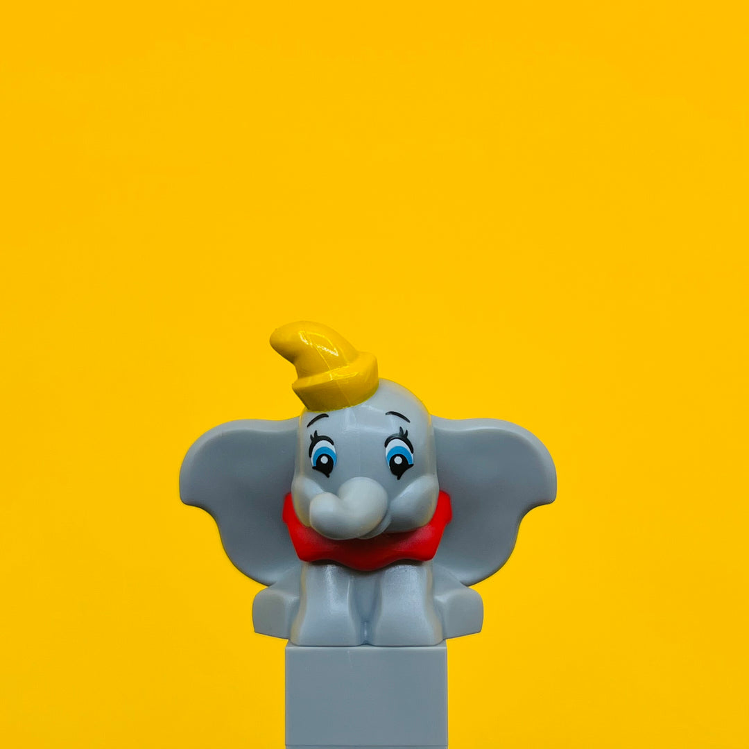 LEGO Minifigure Elephant, Big Ears Sitting with Molded Red Collar and Printed Yellow Hat 103710pb01