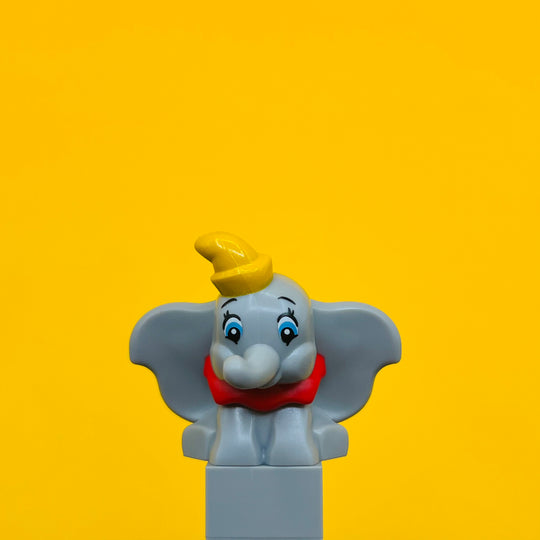 LEGO Minifigure Elephant, Big Ears Sitting with Molded Red Collar and Printed Yellow Hat 103710pb01